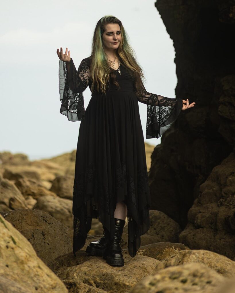 Singer and children's entertainer Gemma in long black Gothic halloween style dress